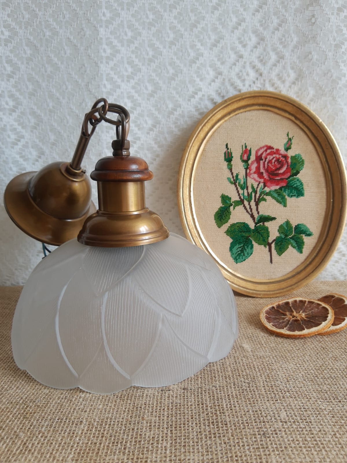 Pair of frosted glass flower pendant lights with vintage wood and brass