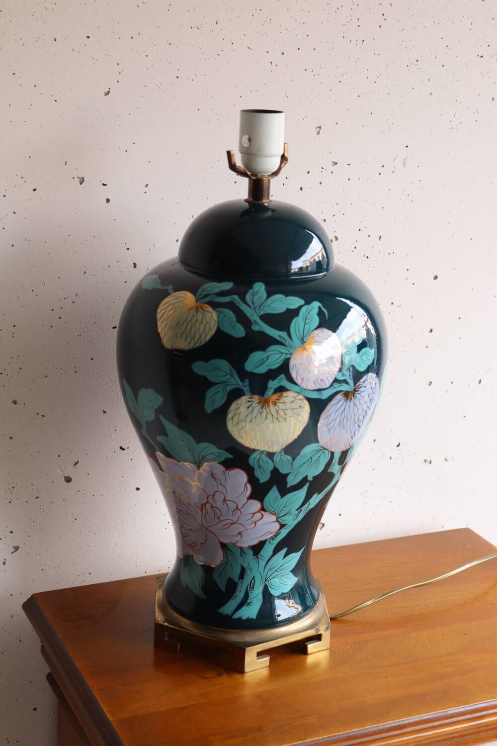 Vintage ceramic lamp with floral decoration.