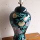 Vintage ceramic lamp with floral decoration.