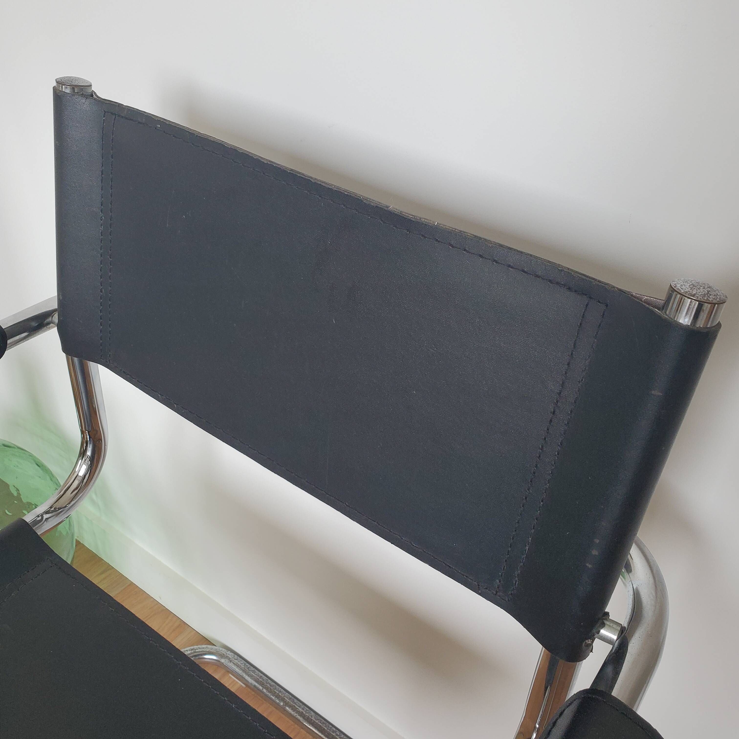 Pair of armchairs in chrome and black leather