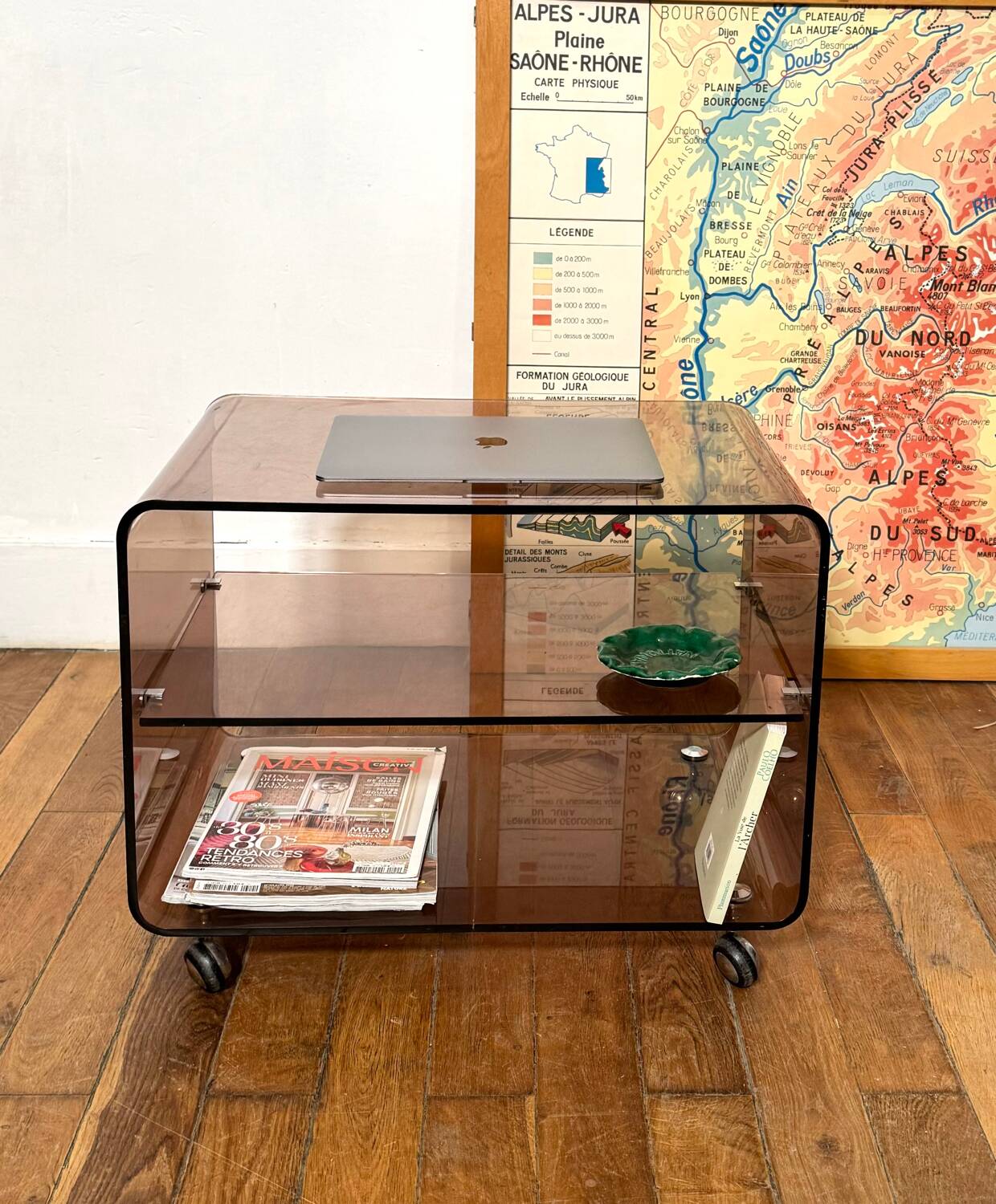 Smoked Plexiglas coffee table on wheels -