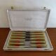 Lot 12 Art Deco style knives in case