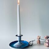 Old enamelled metal candlestick
