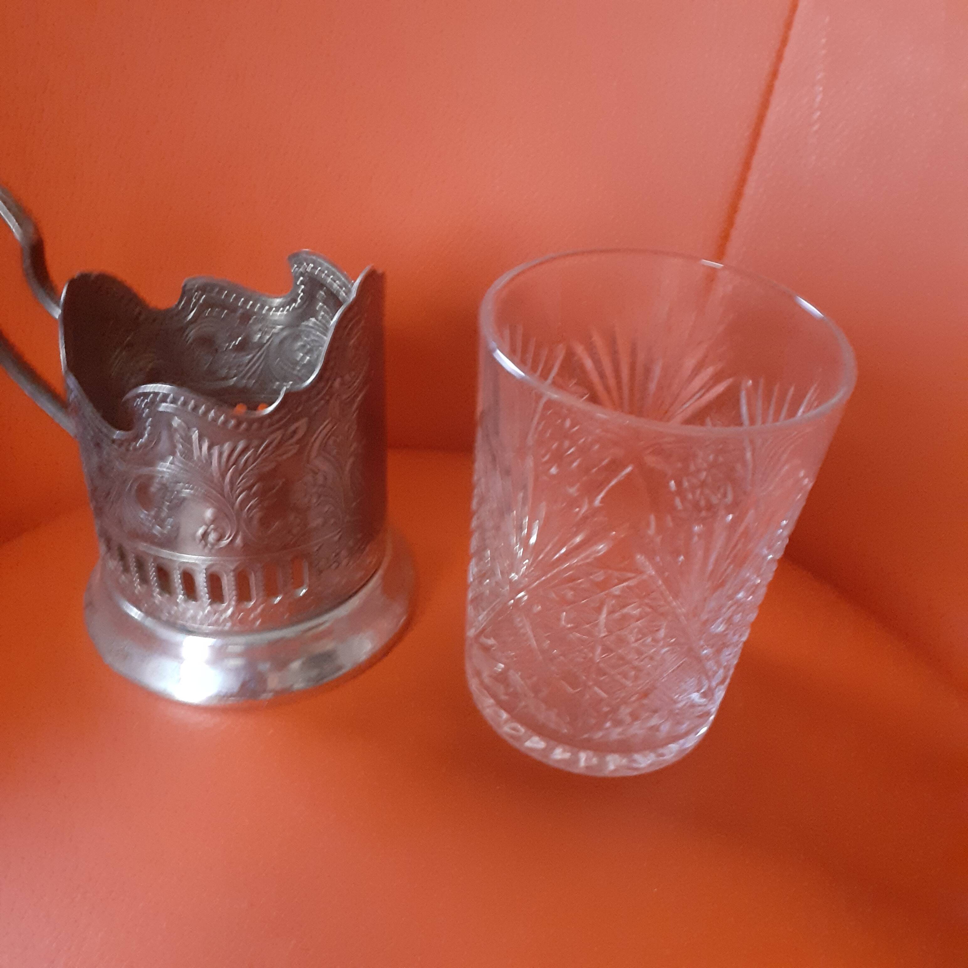 4 glasses engraved on their silver metal support;