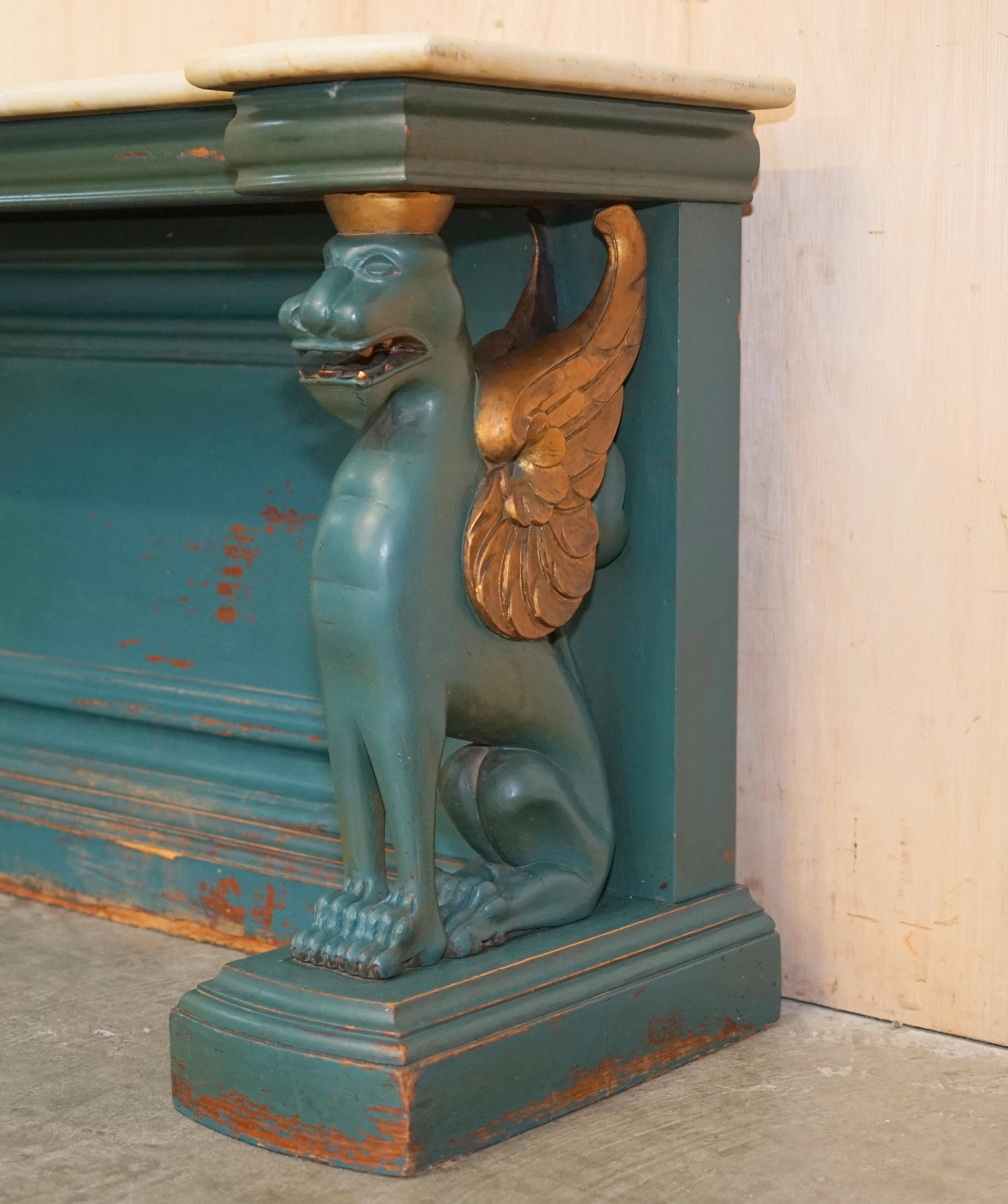 Antique hand-carved console circa 1880 with a marble top.