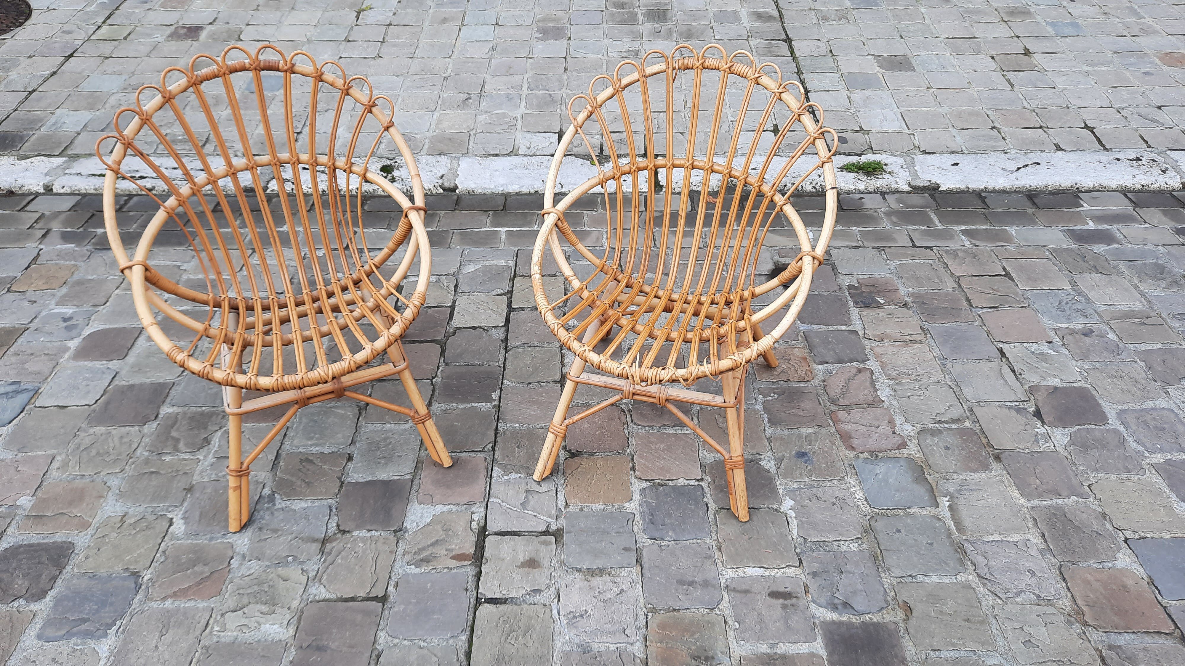 Pairs of shell rattan armchairs from the 50