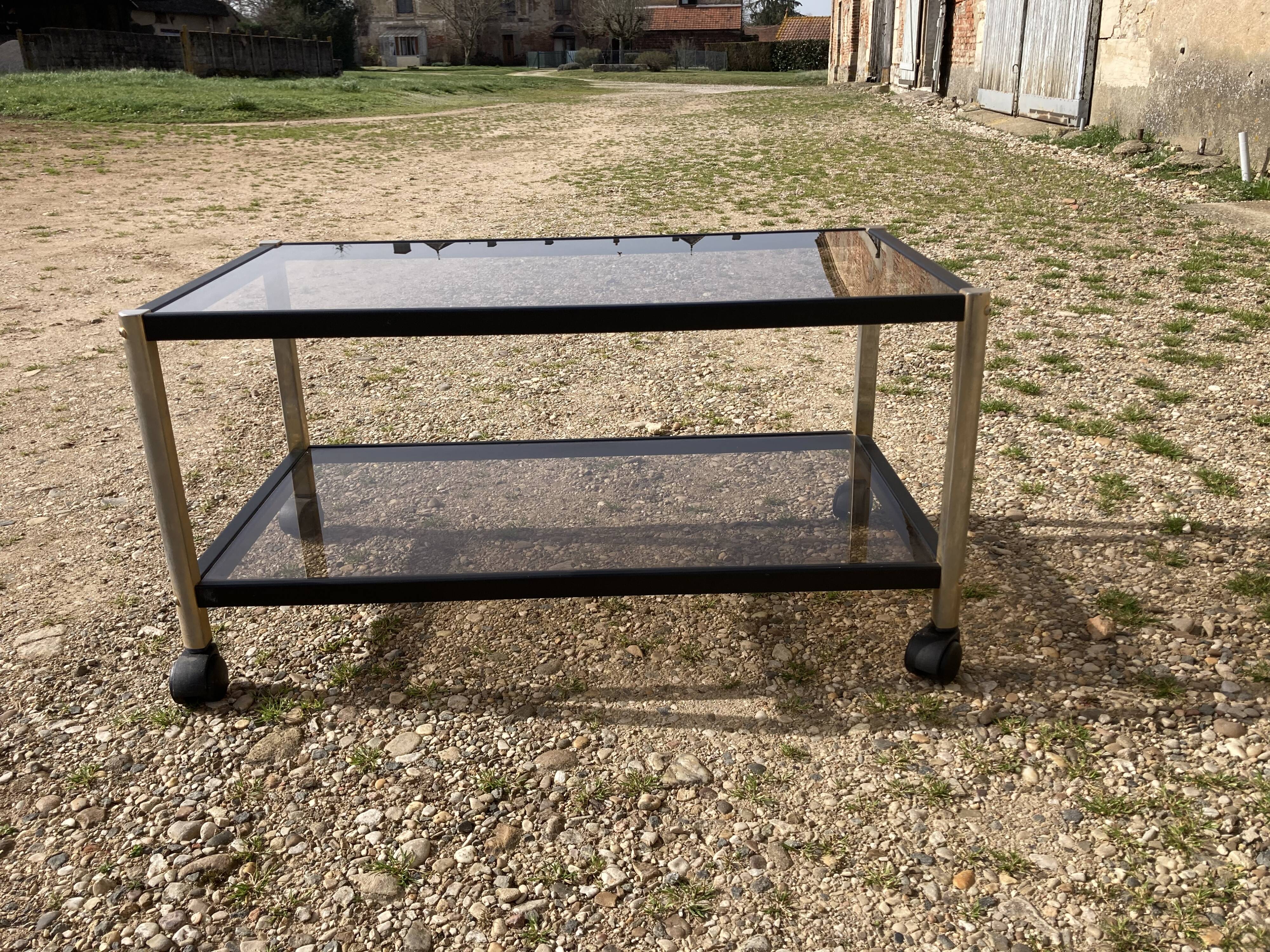 Glass coffee table on wheels