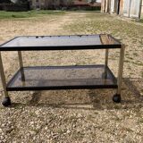 Glass coffee table on wheels