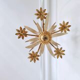 Vintage wrought iron chandelier decorated with golden and beige reeds