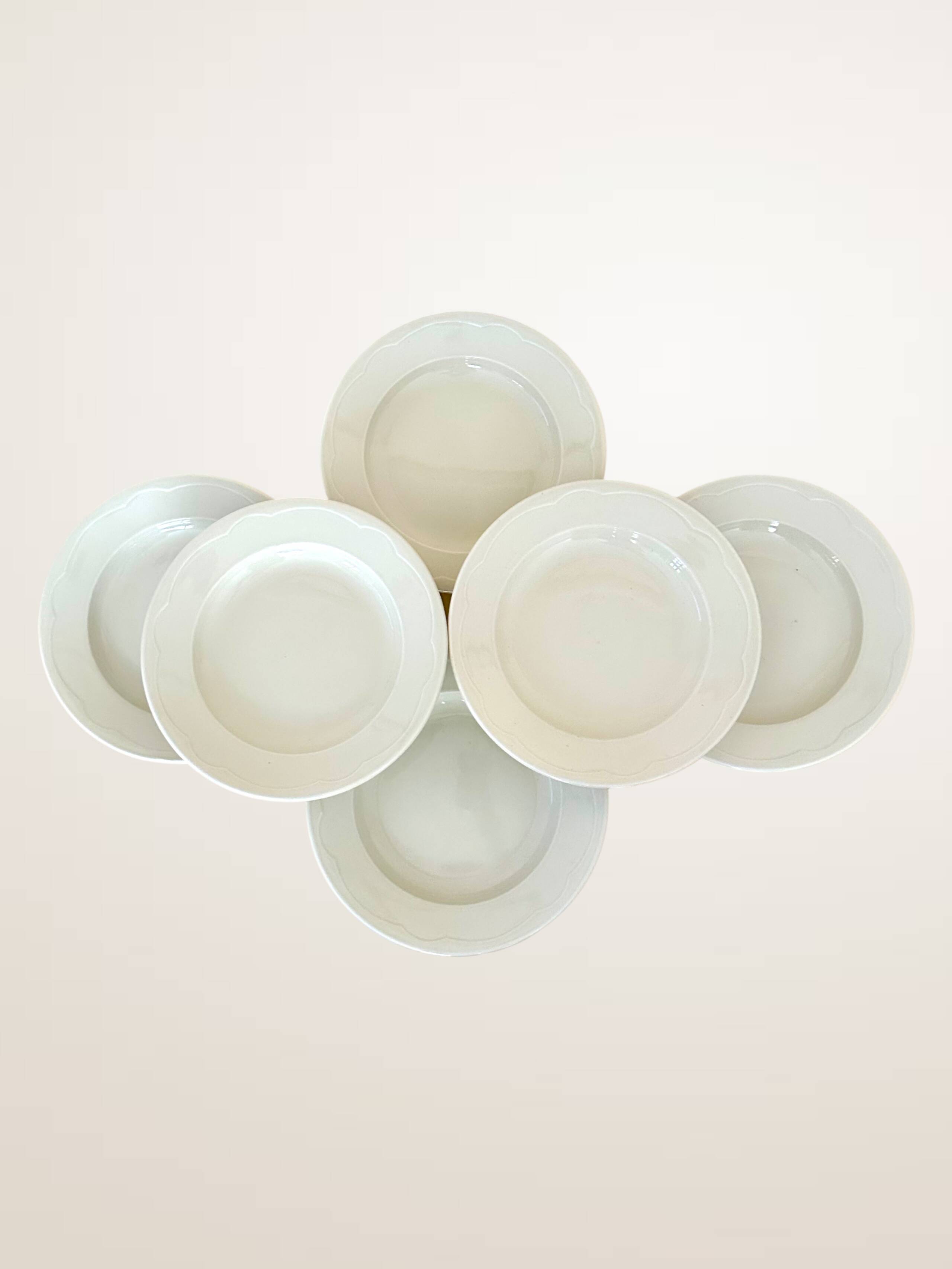 Set of six white porcelain deep plates by Pillivuyt.