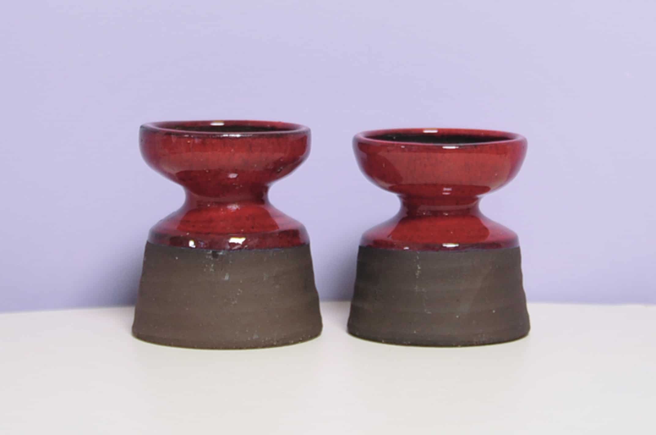 set x2 brown & red stoneware candlestick