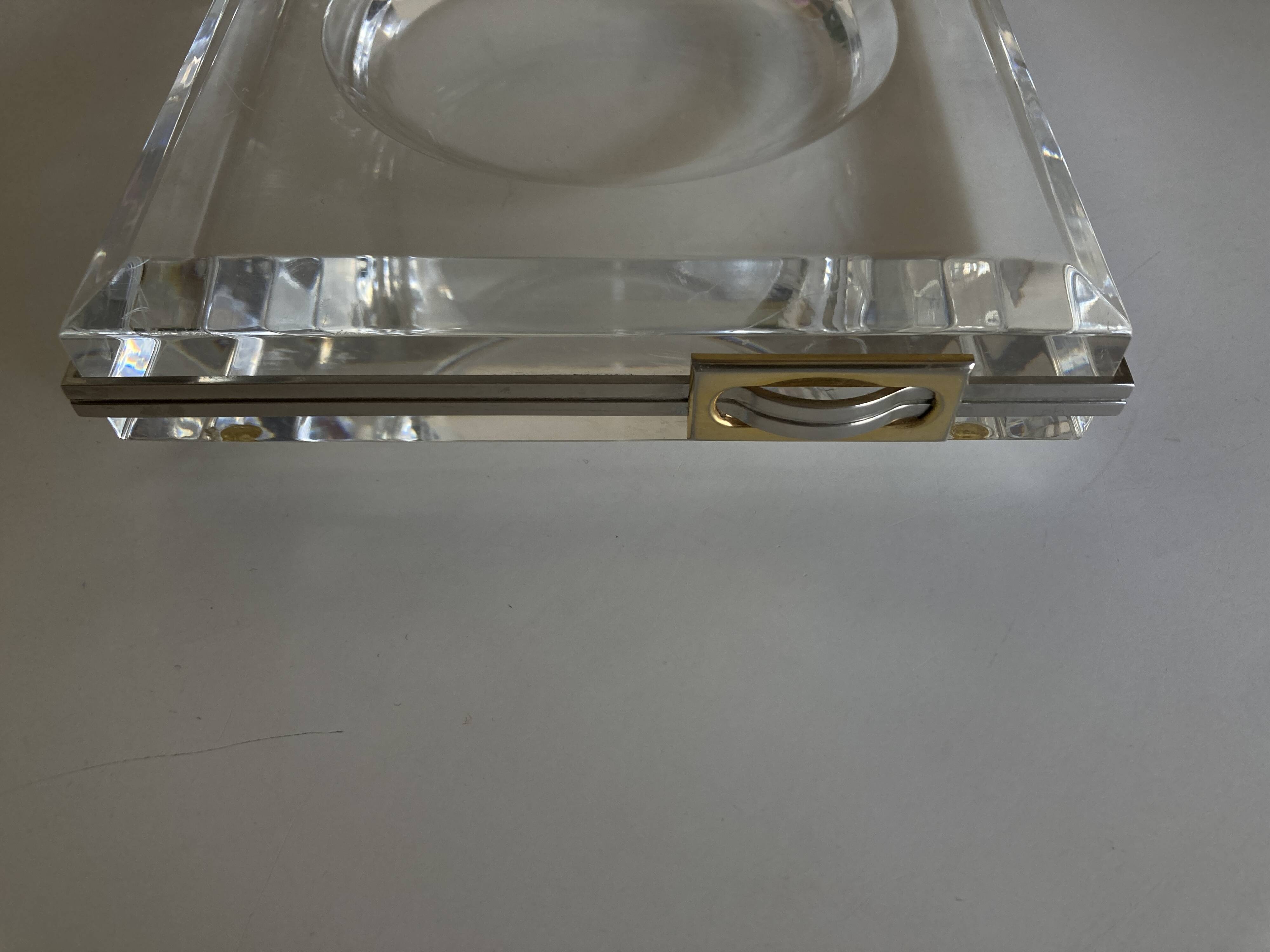 Plexiglas pocket emptier with brass and nickel silver surround, 1975, in the style of Pergay