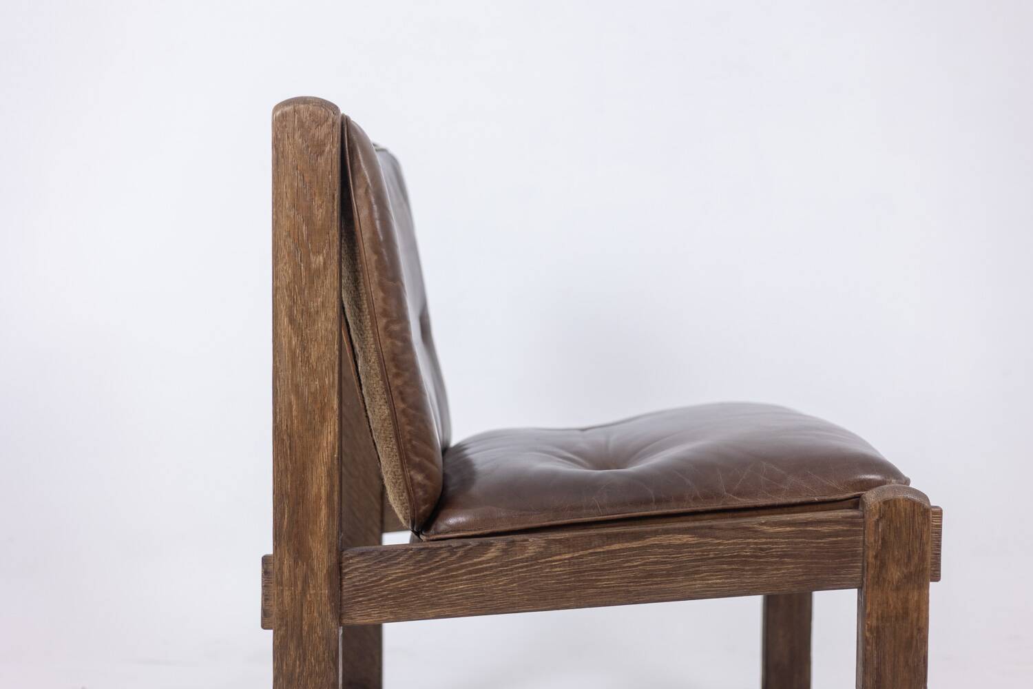 Pair of oak armchairs, upholstered in leather. Work from the 1960s.