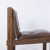 Pair of oak armchairs, upholstered in leather. Work from the 1960s.