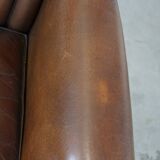 Sheep leather armchair finished with decorative nails