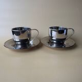 Two vintage mid century modern stainless steel coffee cups with saucer