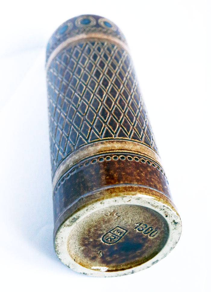 Brown sandstone bottle with chiseled and round navy blue