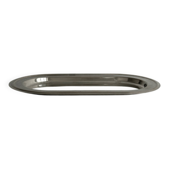 Small oval tray in shiny lightweight metal.
