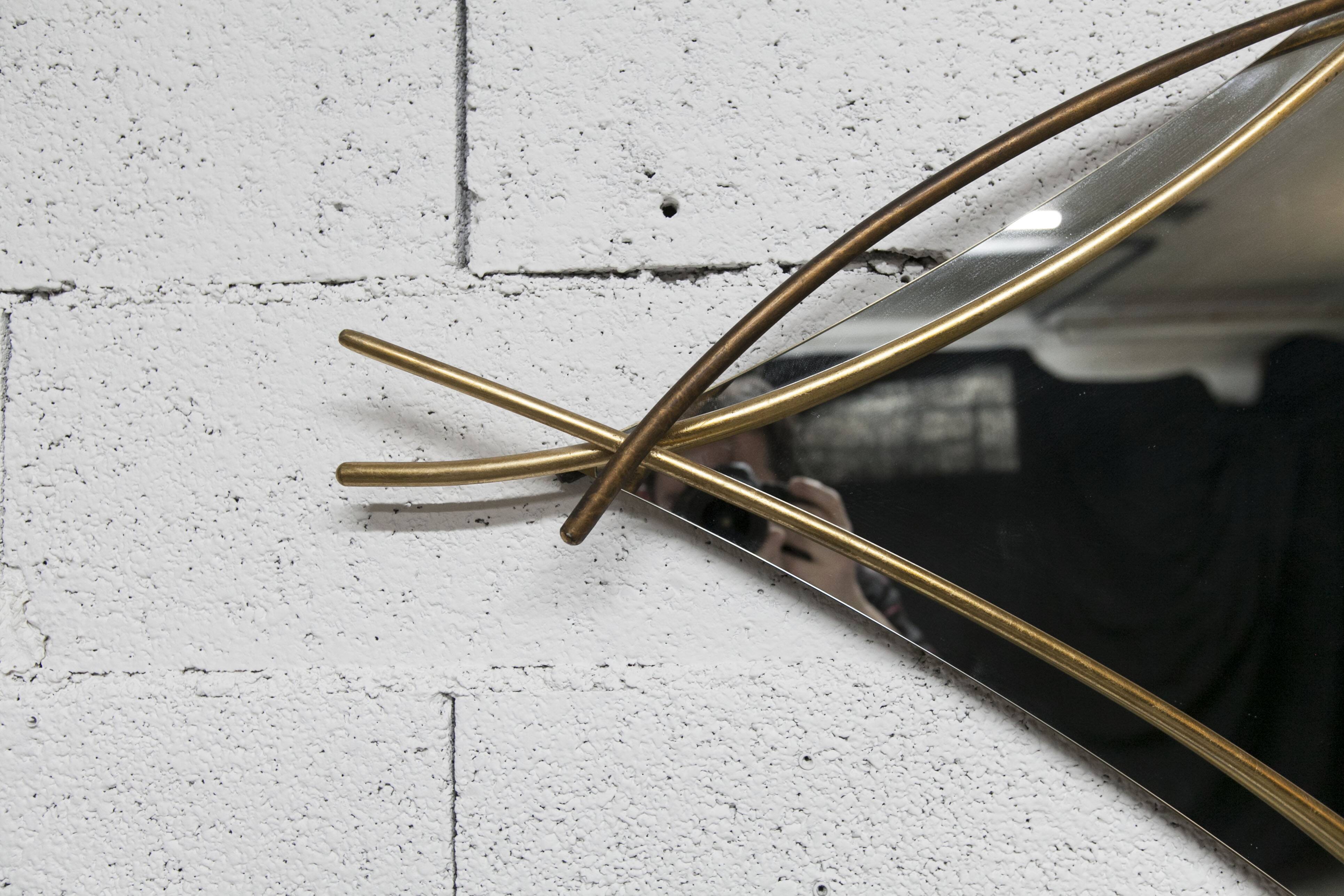 Sculptural mirror with two-tone gilded arches, France, 1970s, 95 x 133 cm