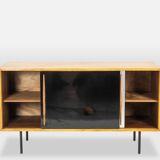 Low ash sideboard with sliding doors. 1960s.