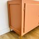 Terracotta painted wooden sideboard