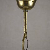 Suspension en verre blanc et motif de fleurs.