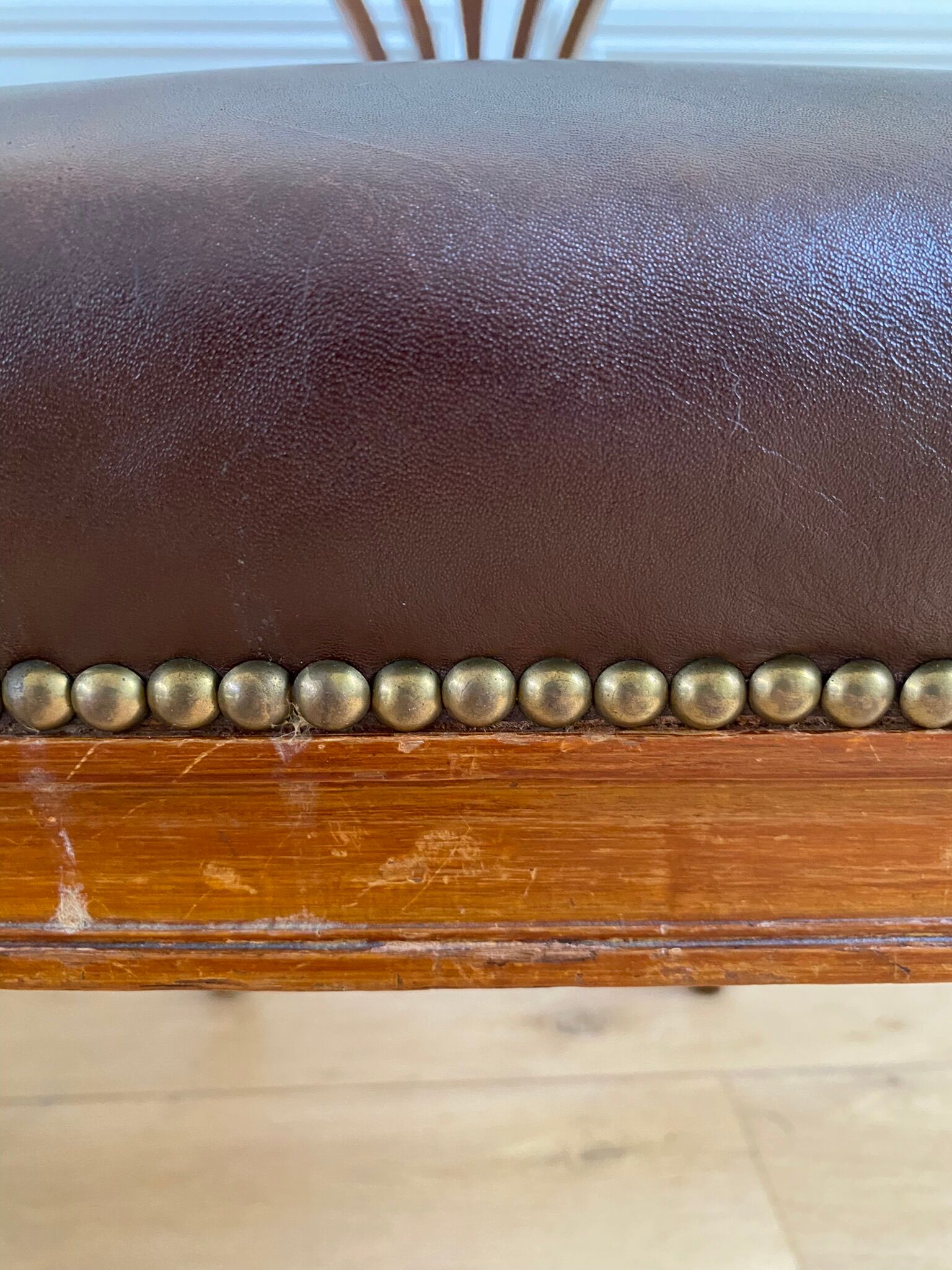 Vintage office chair in wood and brown studded leather late nineteenth