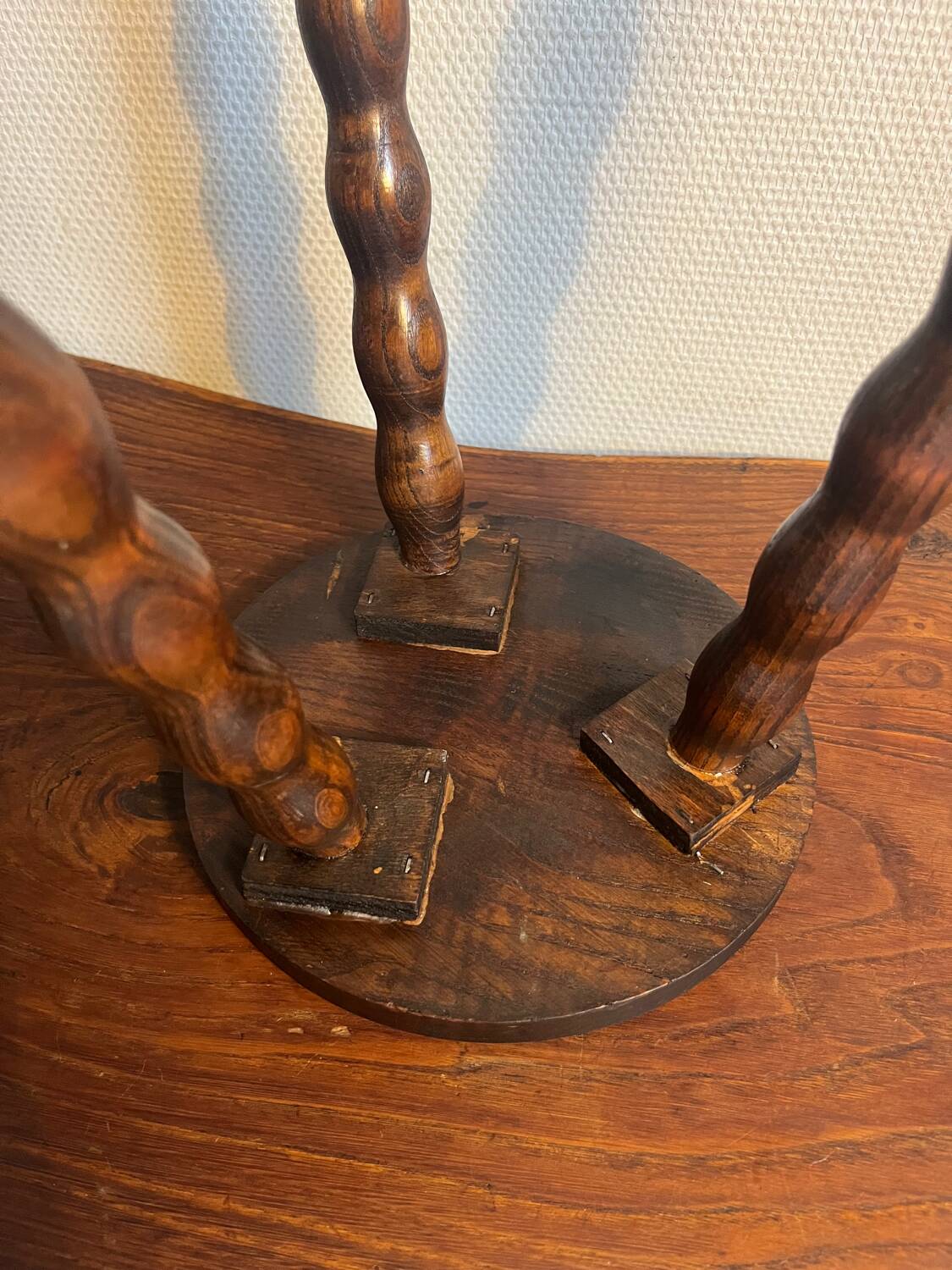 Round wooden tripod stool