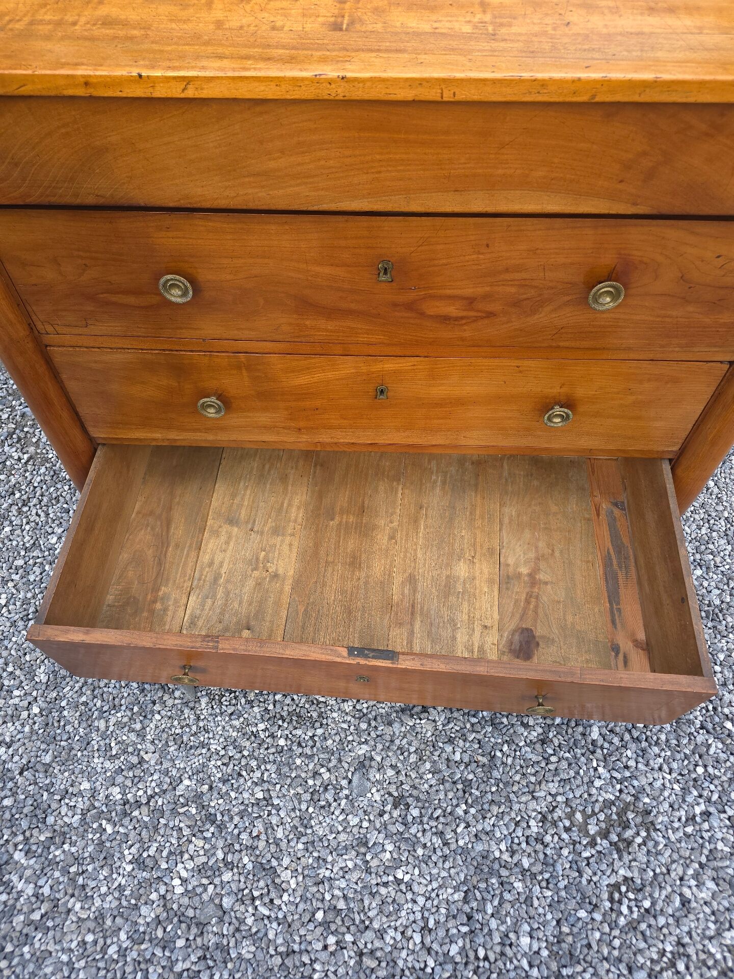 Empire style chest of drawers in cherry wood