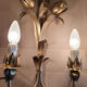 Gold sconces with floral decoration