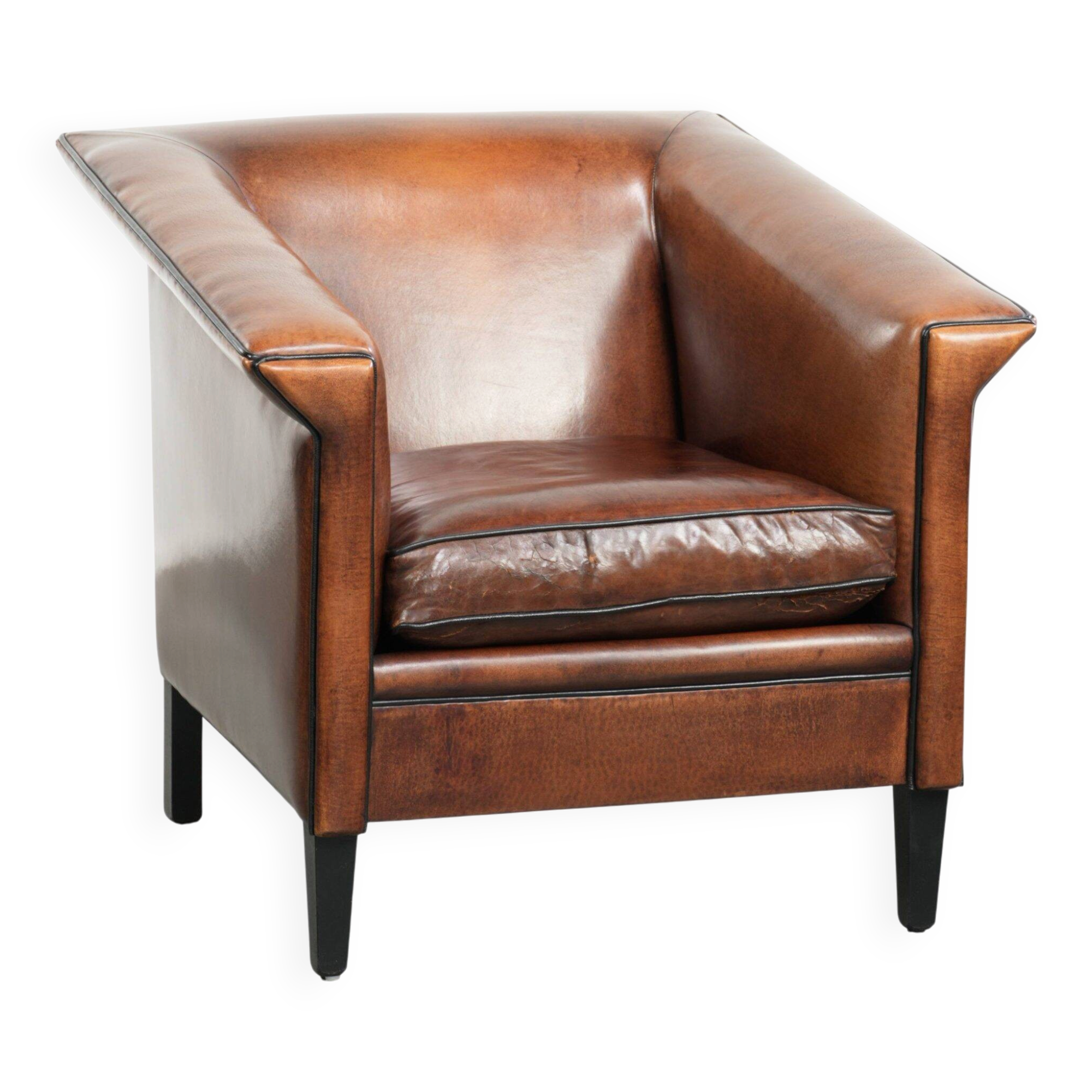 Sleek sheepskin Art Deco design armchair with black piping