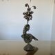 metal sculpture in sheet metal representing a peacock, work from the 1960s