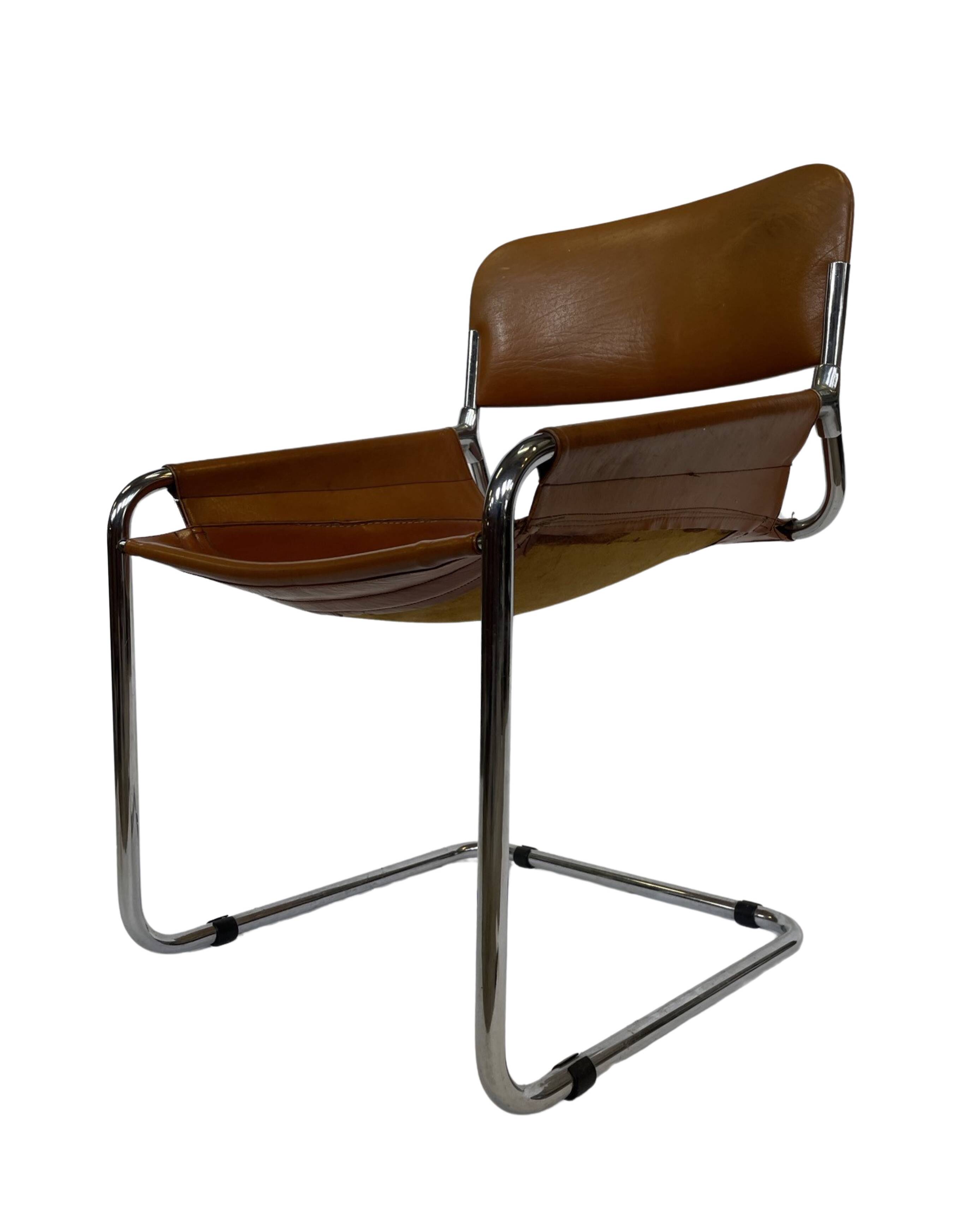 vintage dining room chair in cognac leather and chrome 1970s Italy