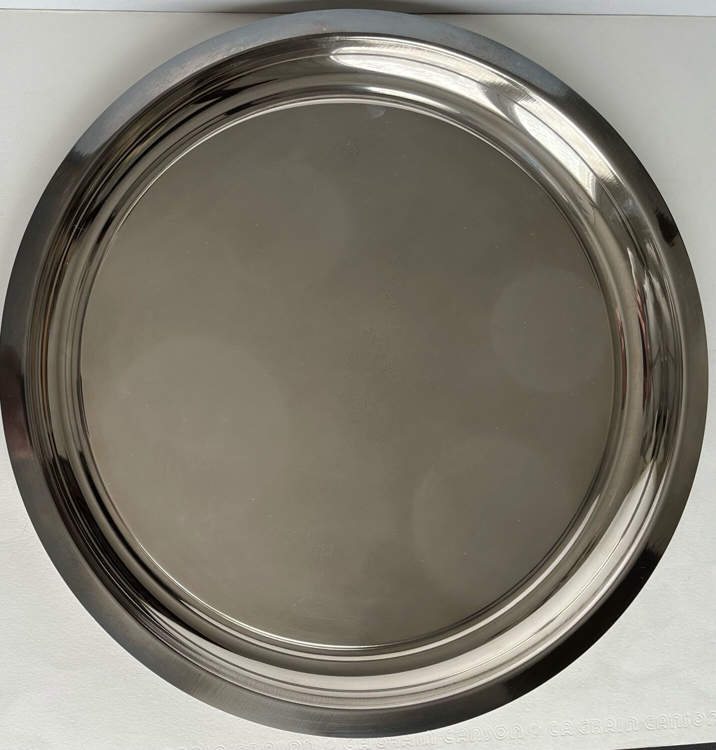 Circular silver metal tray