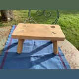 Small bench, footrest in artisanal raw wood