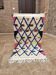 Small handmade Moroccan rug, small Beni Ouarain rug in Berber wool,