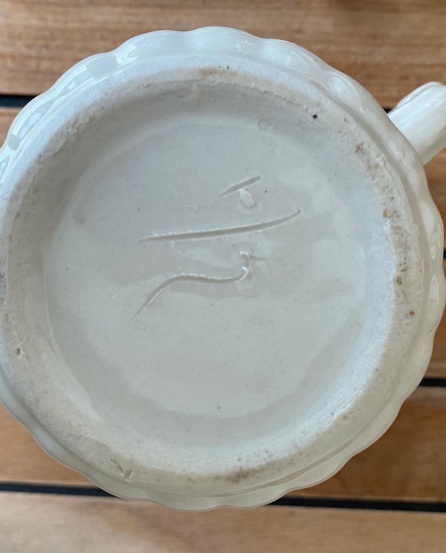 Small pitcher in iron earth with double old decoration