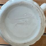 Small pitcher in iron earth with double old decoration