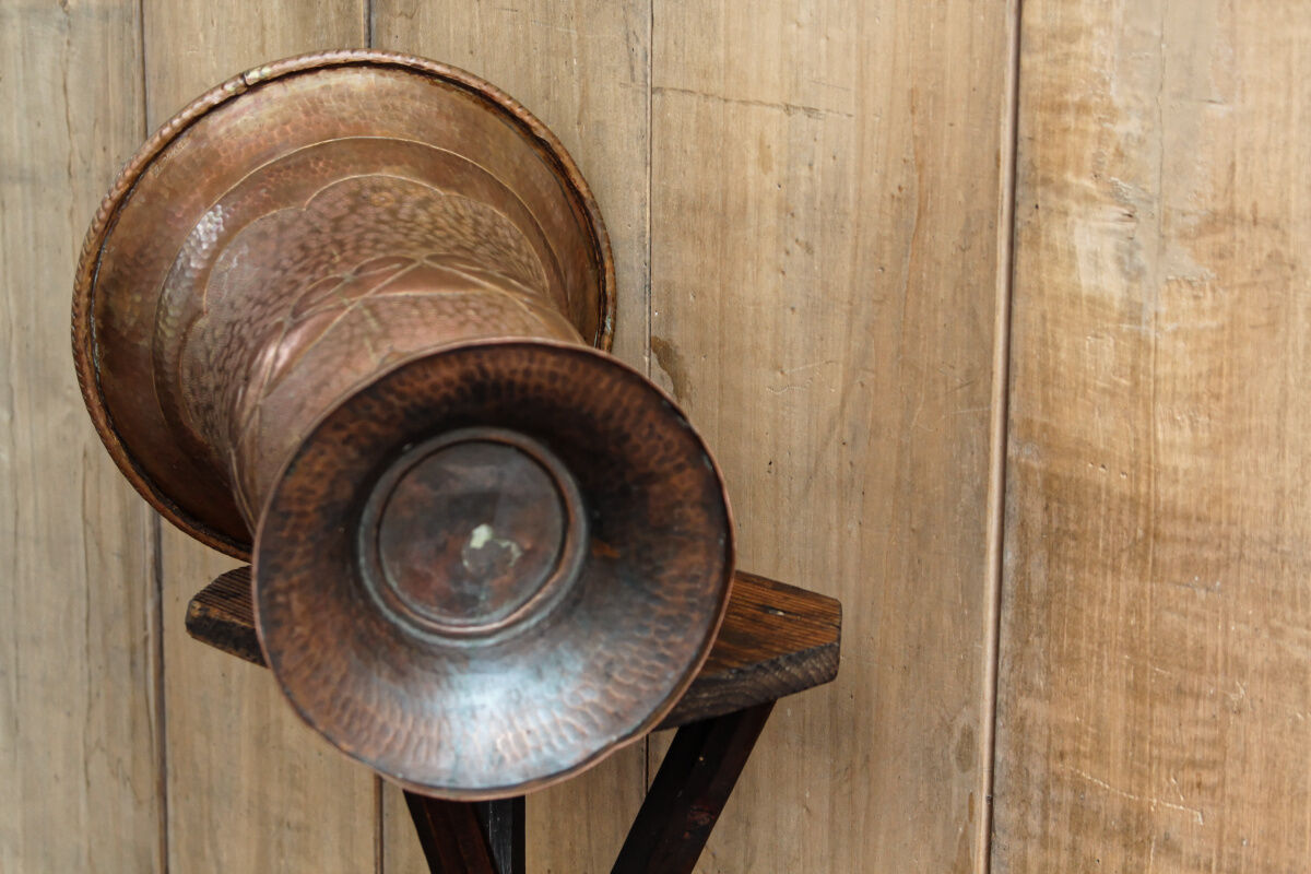 Copper vase hammered on pedestal