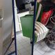 Adjustable mirror on vintage blue tubular structure stand