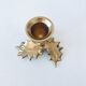 Candlestick in brass holly design