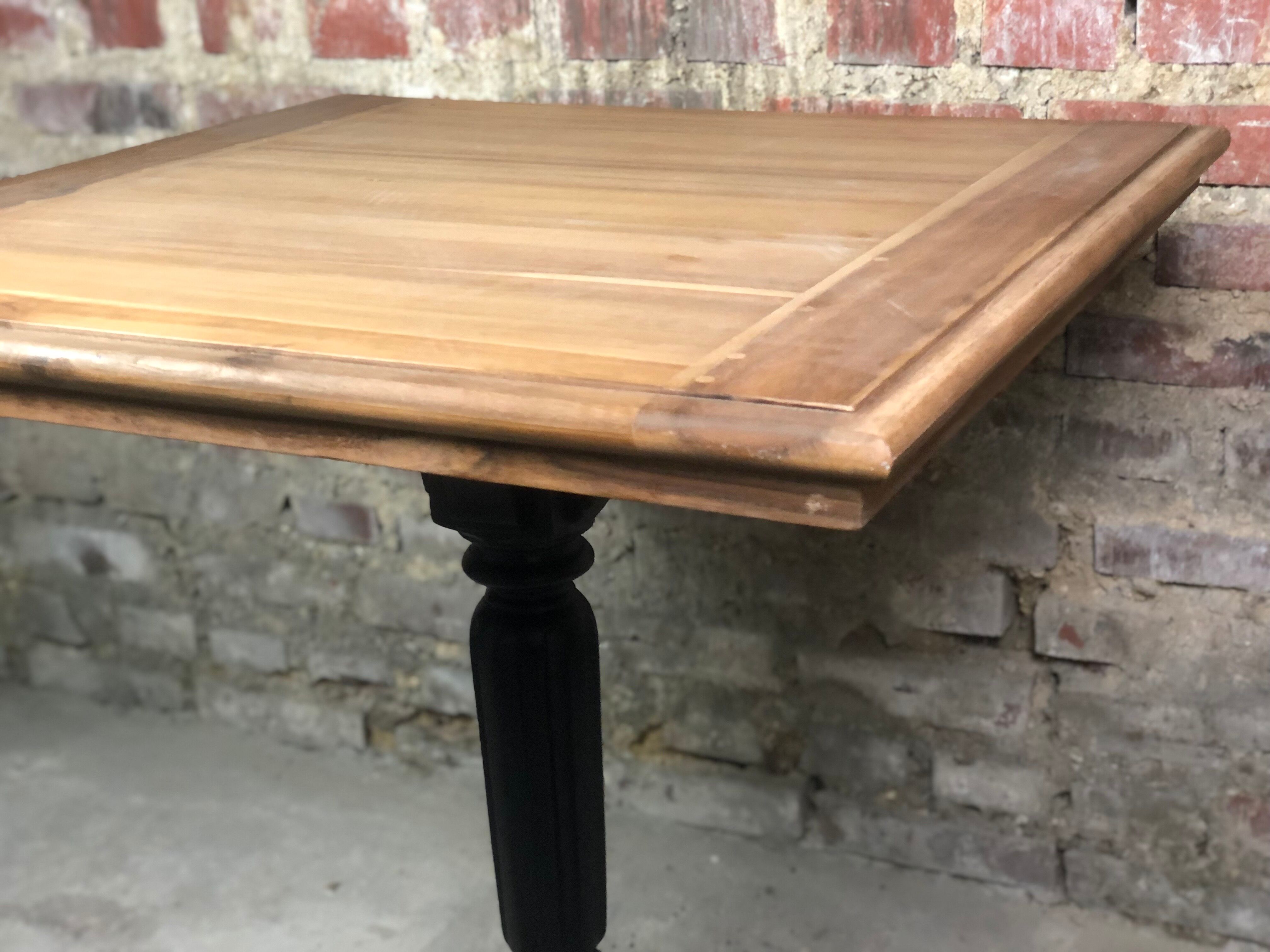 Bistro table in wood black foot and raw top