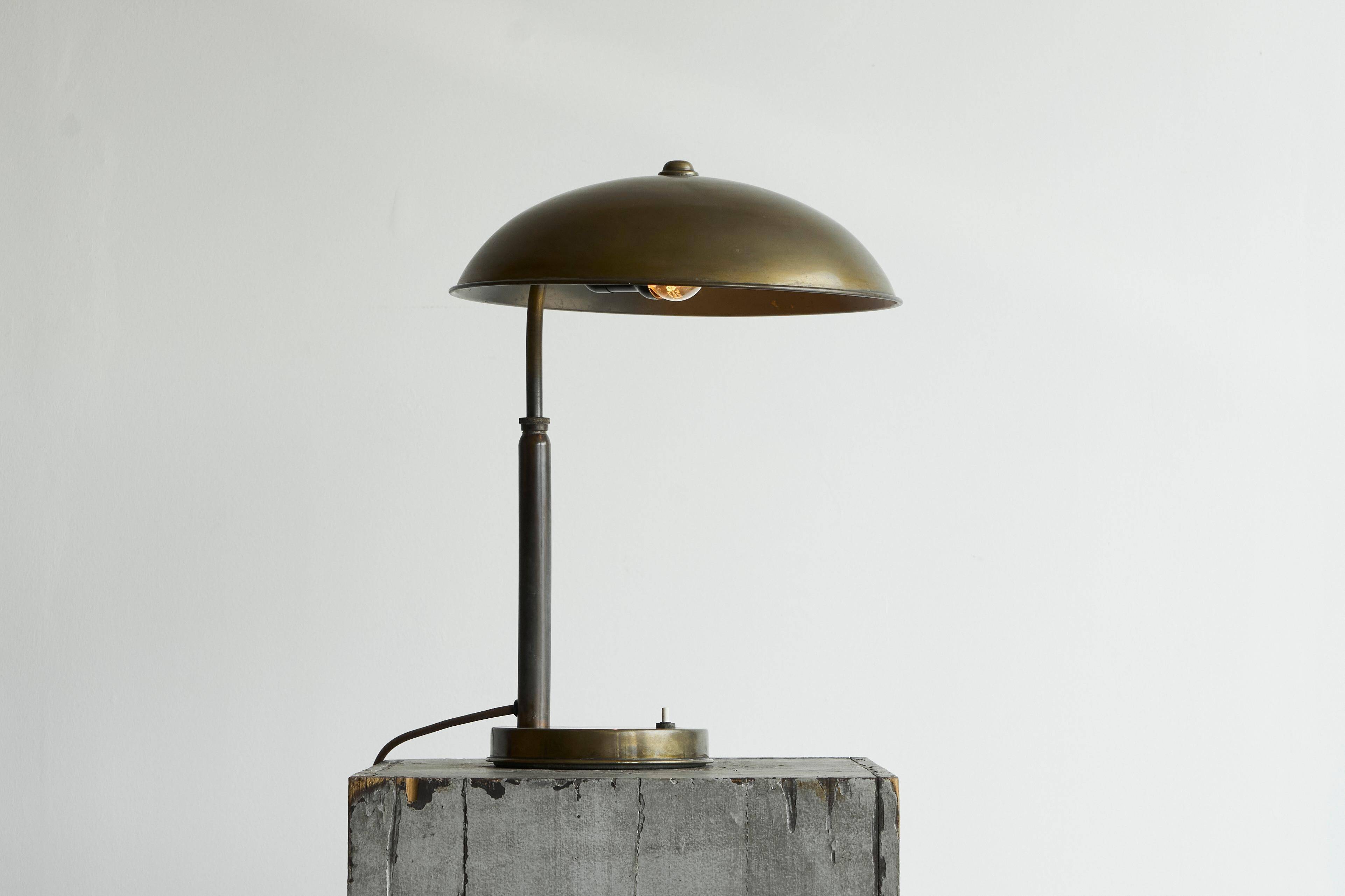 Bauhaus style table lamp in patinated brass from the 1930s.