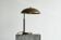 Bauhaus style table lamp in patinated brass from the 1930s.