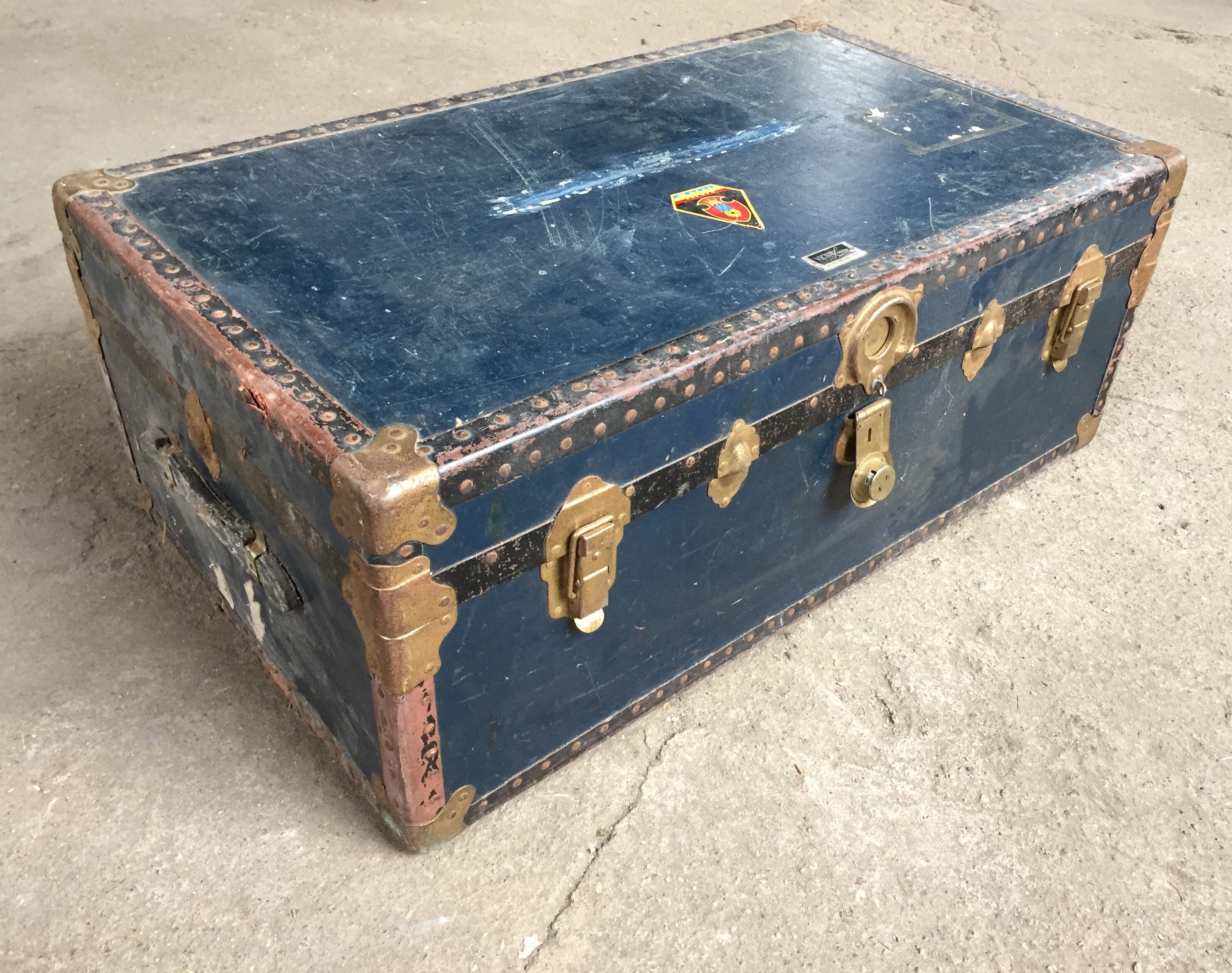 Large blue travel trunk