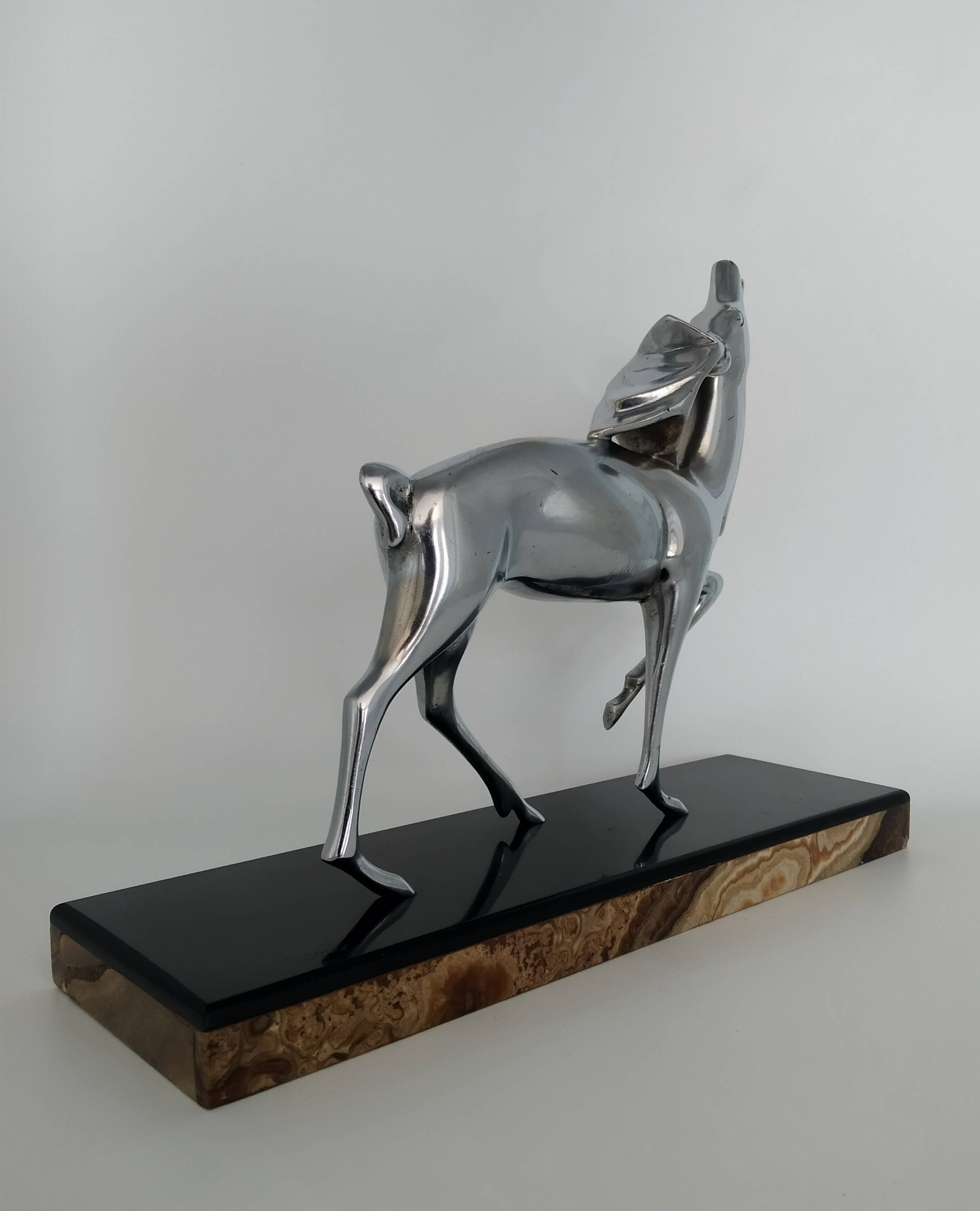 Silvered bronze sculpture signed by Michel Decoux.