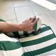 Small green striped sofa