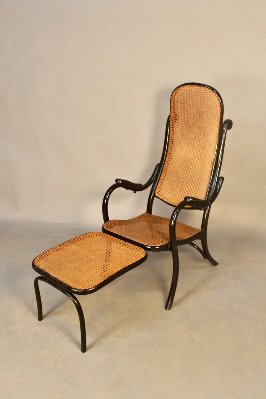 Bentwood cane armchair with mechanism and footrest