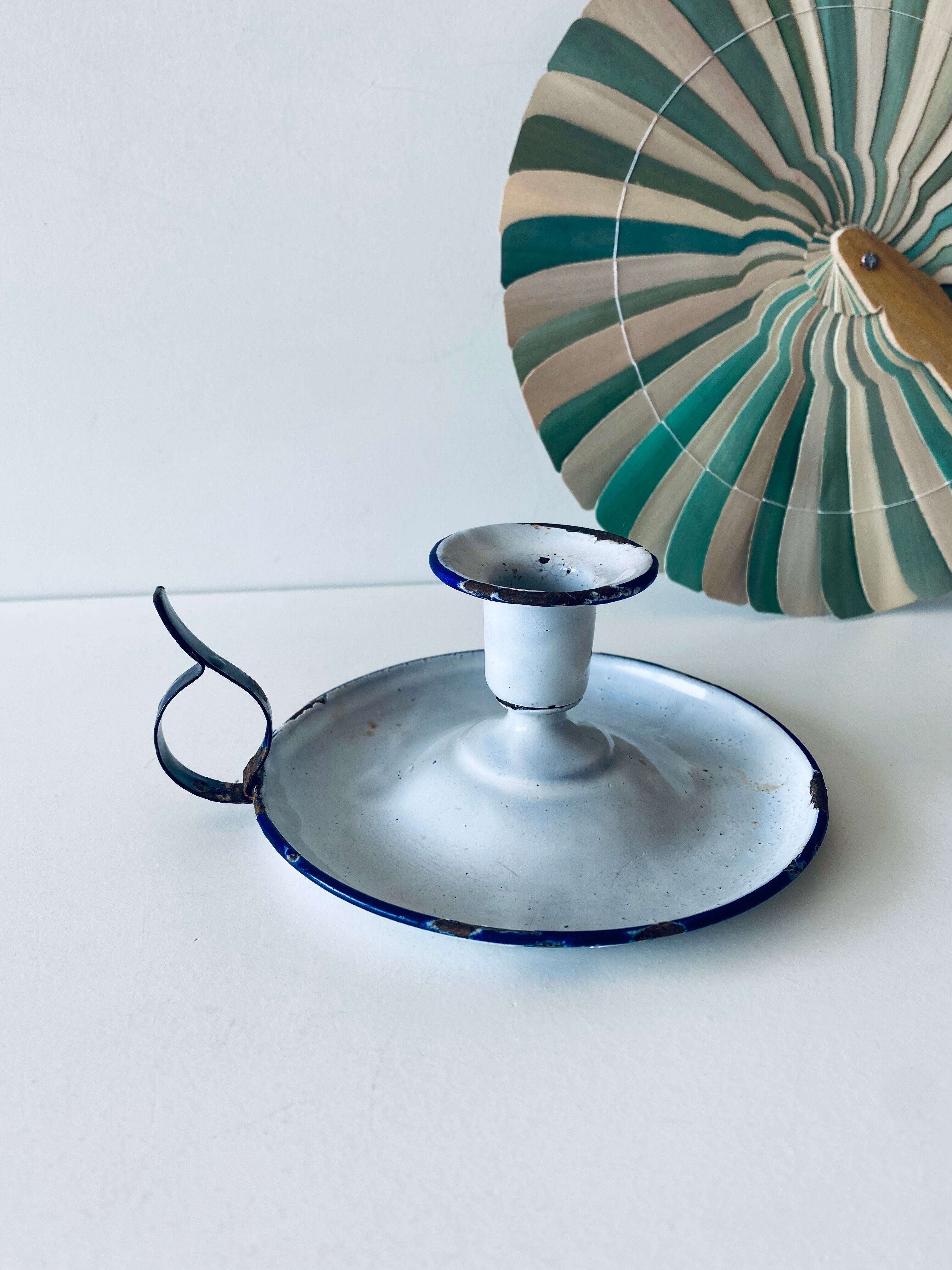 Antique candle holder in white and blue enamelled metal