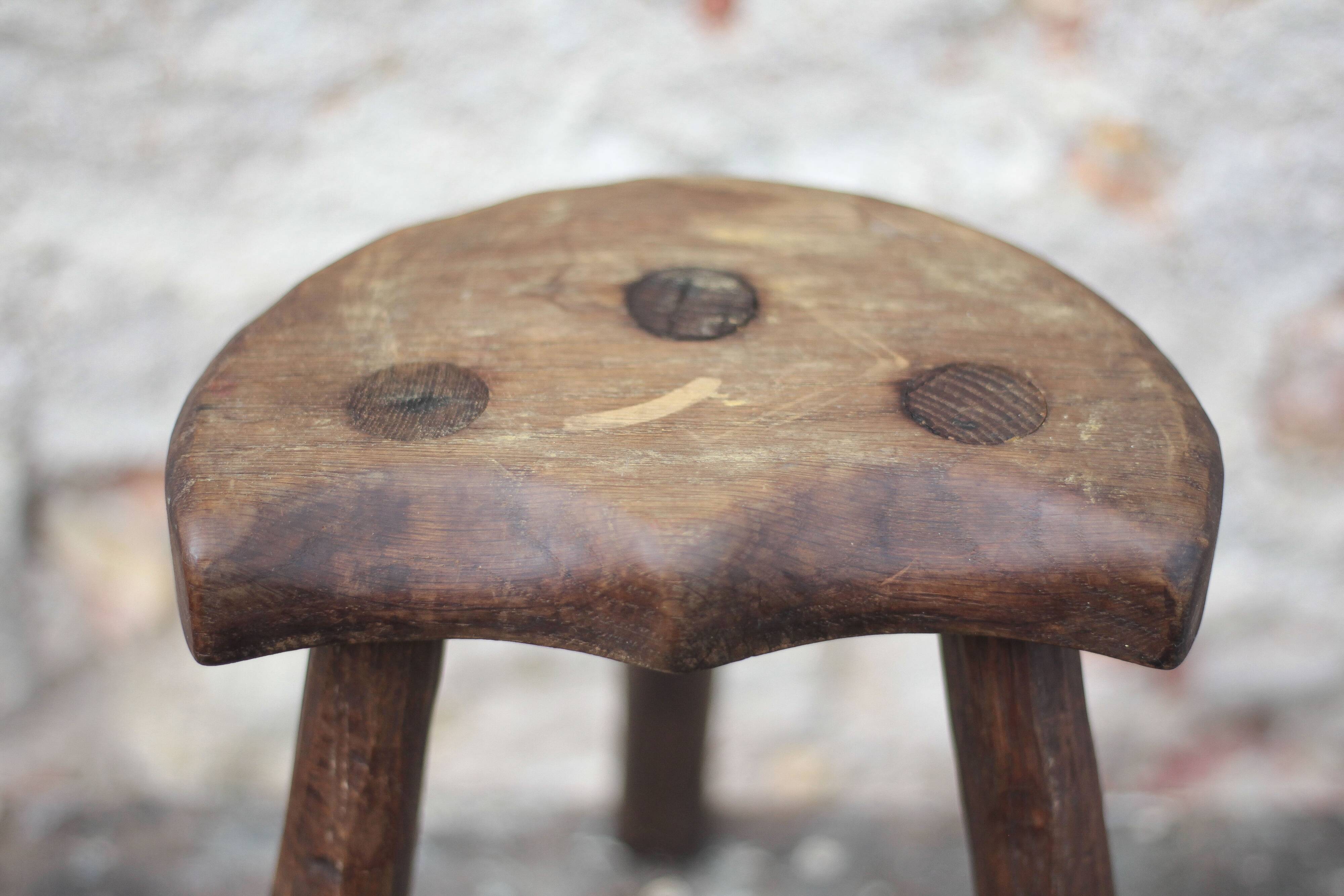 Vintage wooden tripod stool, mountain work, wabi-sabi, shepherd.
